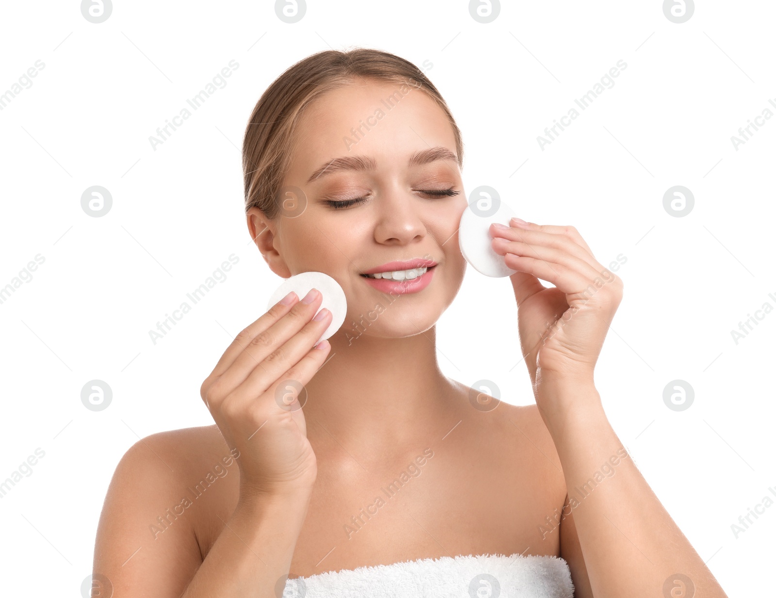 Photo of Beautiful young woman with cotton pads on white background