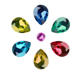 Set of beautiful gemstones on white background, top view
