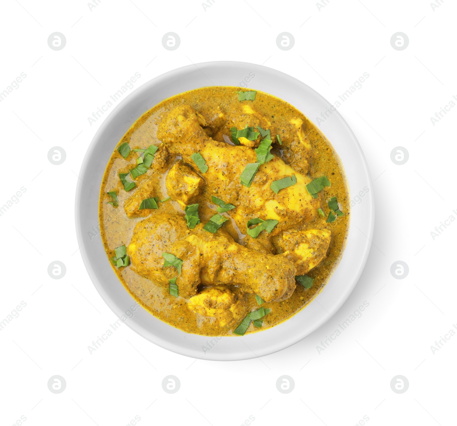 Photo of Delicious chicken with curry sauce and basil isolated on white, top view