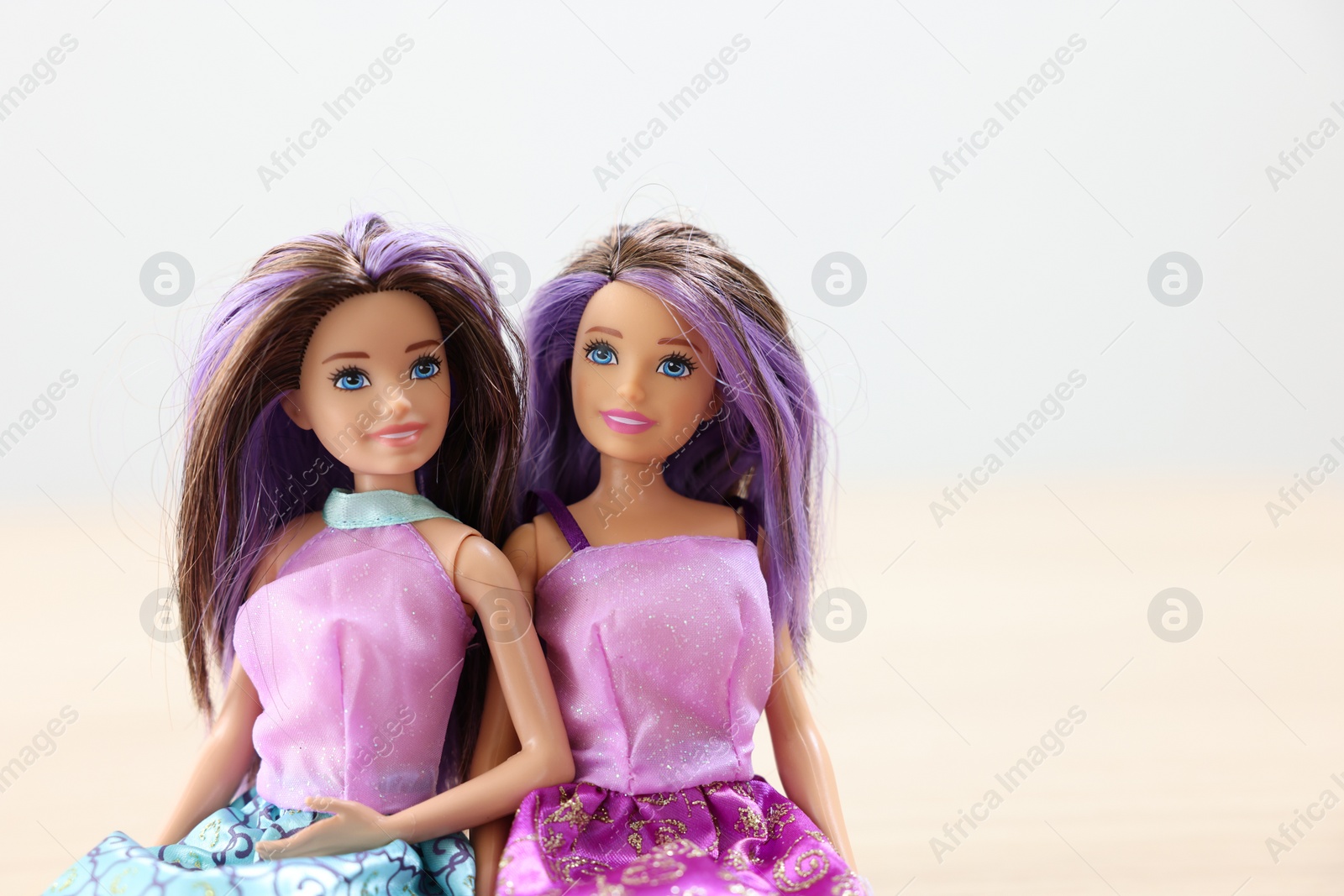 Photo of Leiden, Netherlands - September 20, 2023: Beautiful Barbie dolls on light blurred background, space for text