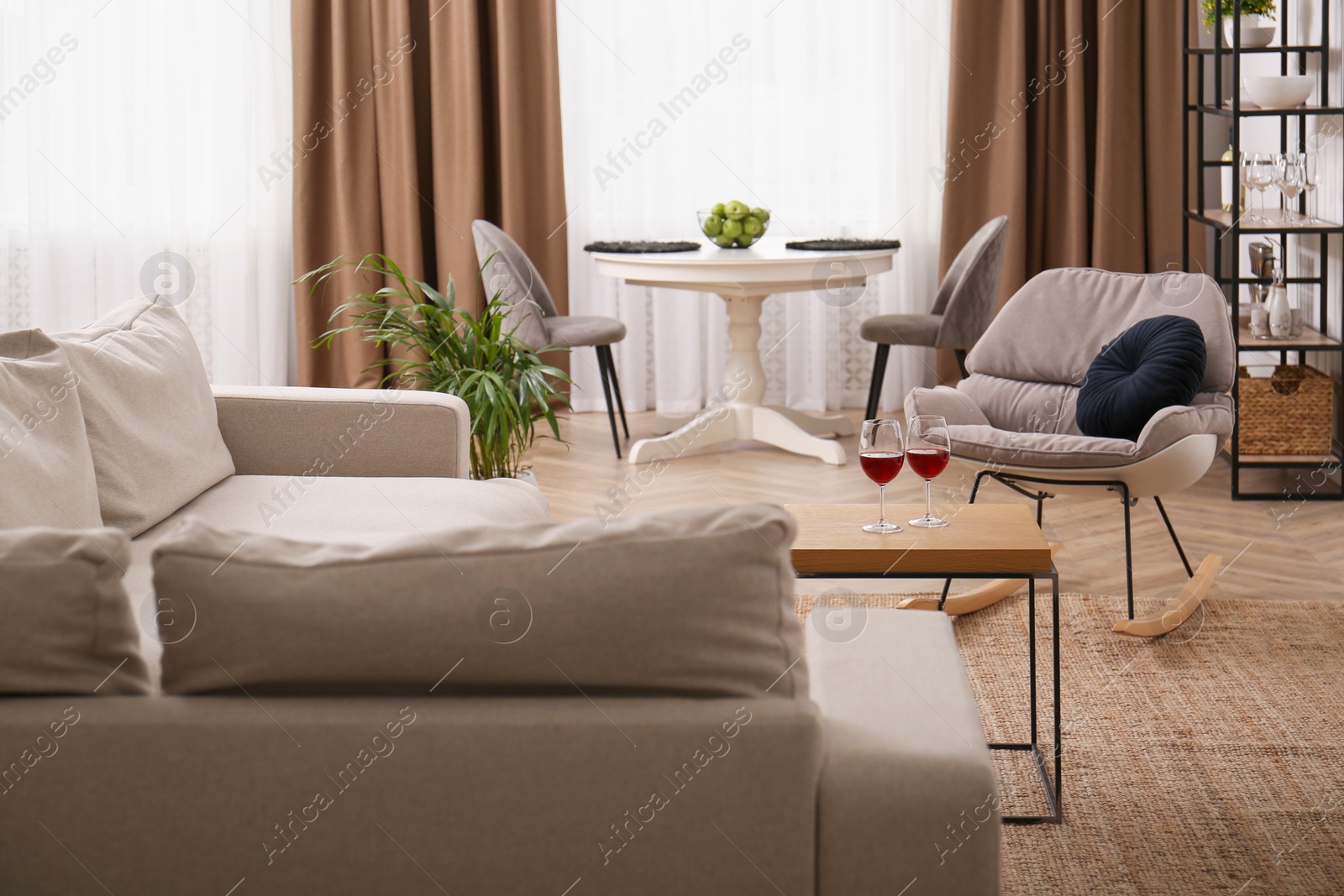 Photo of Stylish living room interior with comfortable sofa