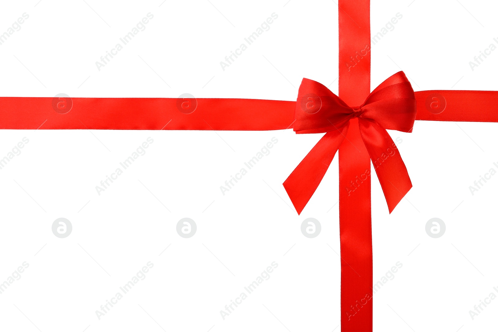 Photo of Red ribbon with bow on white background. Festive decoration