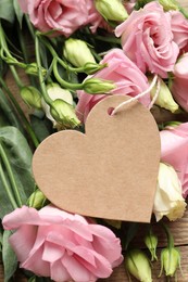 Happy Mother's Day. Beautiful flowers and blank heart shaped card on wooden table