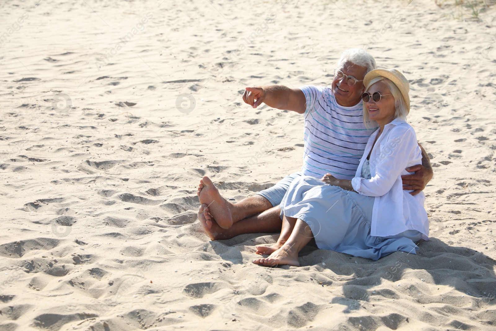 Photo of Mature couple spending time together on sea beach