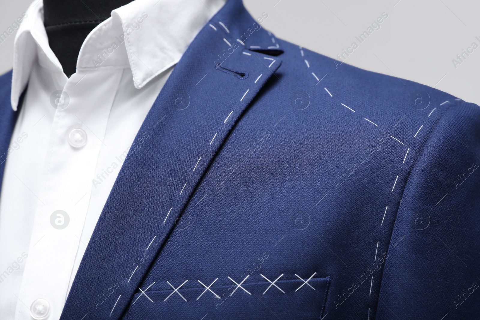 Photo of Semi-ready jacket and shirt on mannequin, closeup view