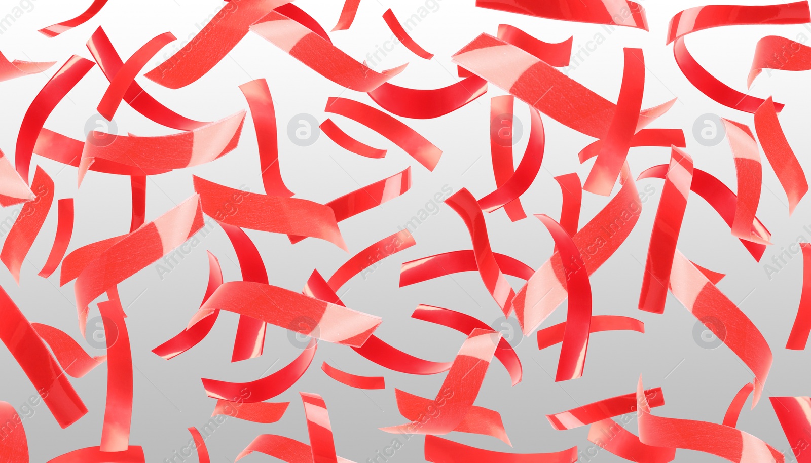 Image of Bright red confetti falling on gradient grey background. Banner design