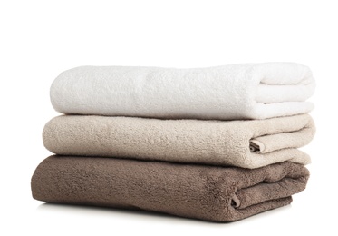 Folded soft terry towels on white background