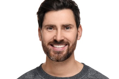 Smiling man with healthy clean teeth on white background