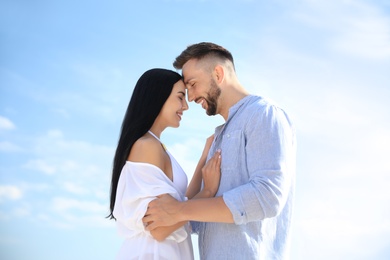 Photo of Happy young couple on sunny day. Beach holiday