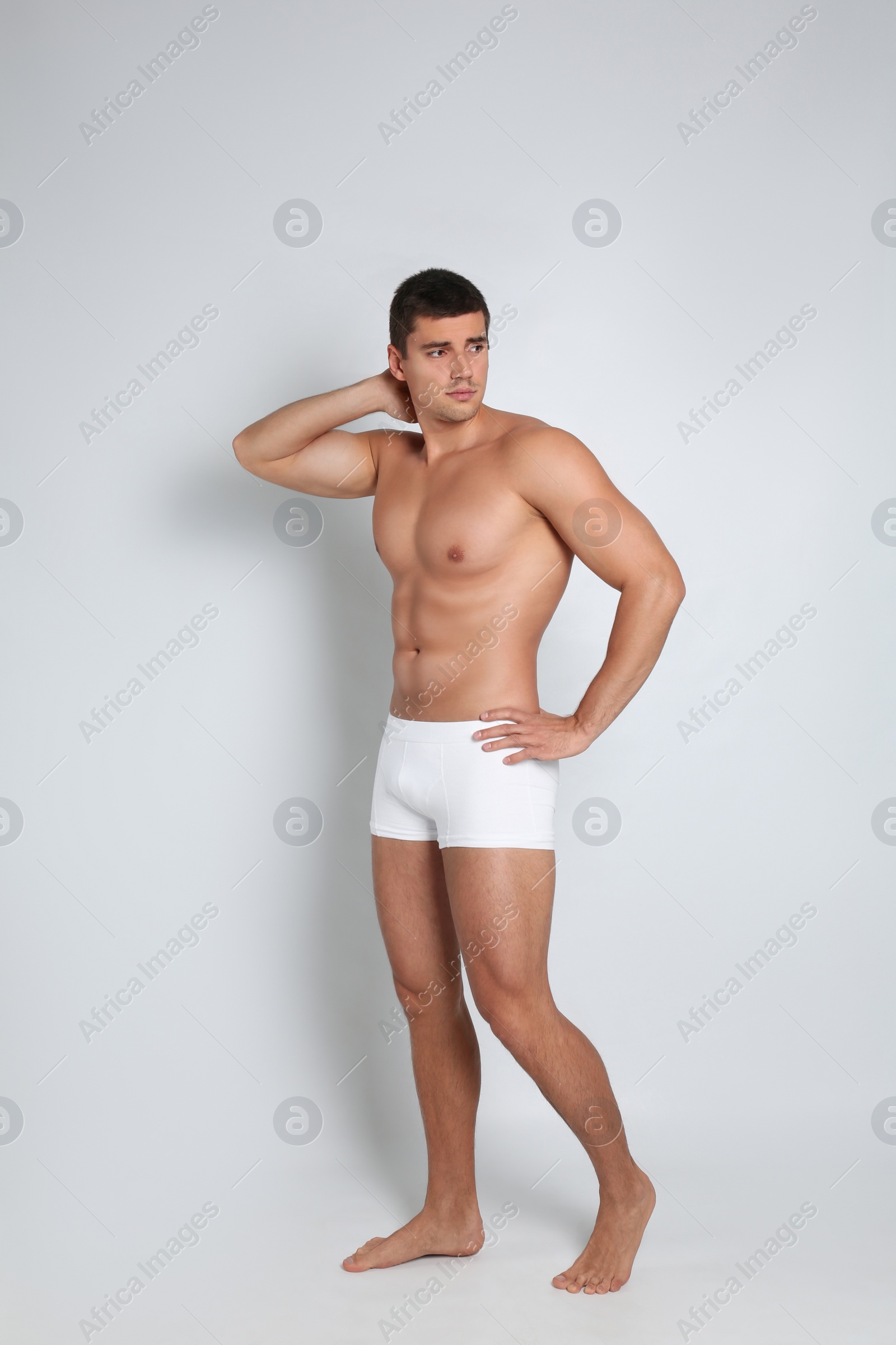 Photo of Man with sexy body on light background