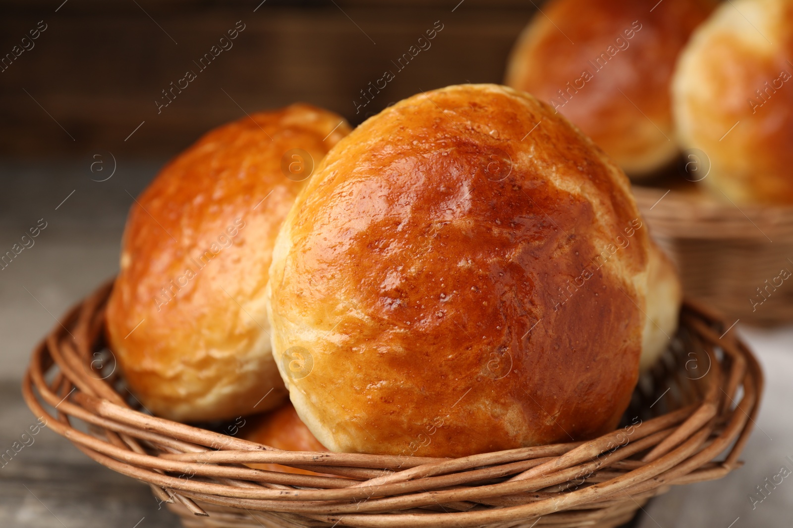 Photo of Freshly baked soda water scones on wooden table, closeup