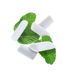 Image of Fresh mint leaves and chewing gum pads falling on white background