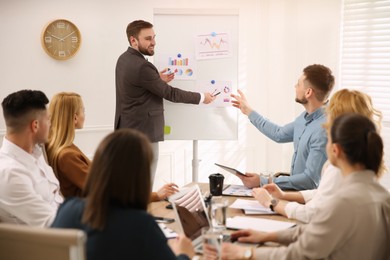 Photo of Businesspeople having meeting in office. Management consulting