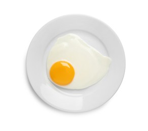 Photo of Plate with tasty fried egg isolated on white, top view