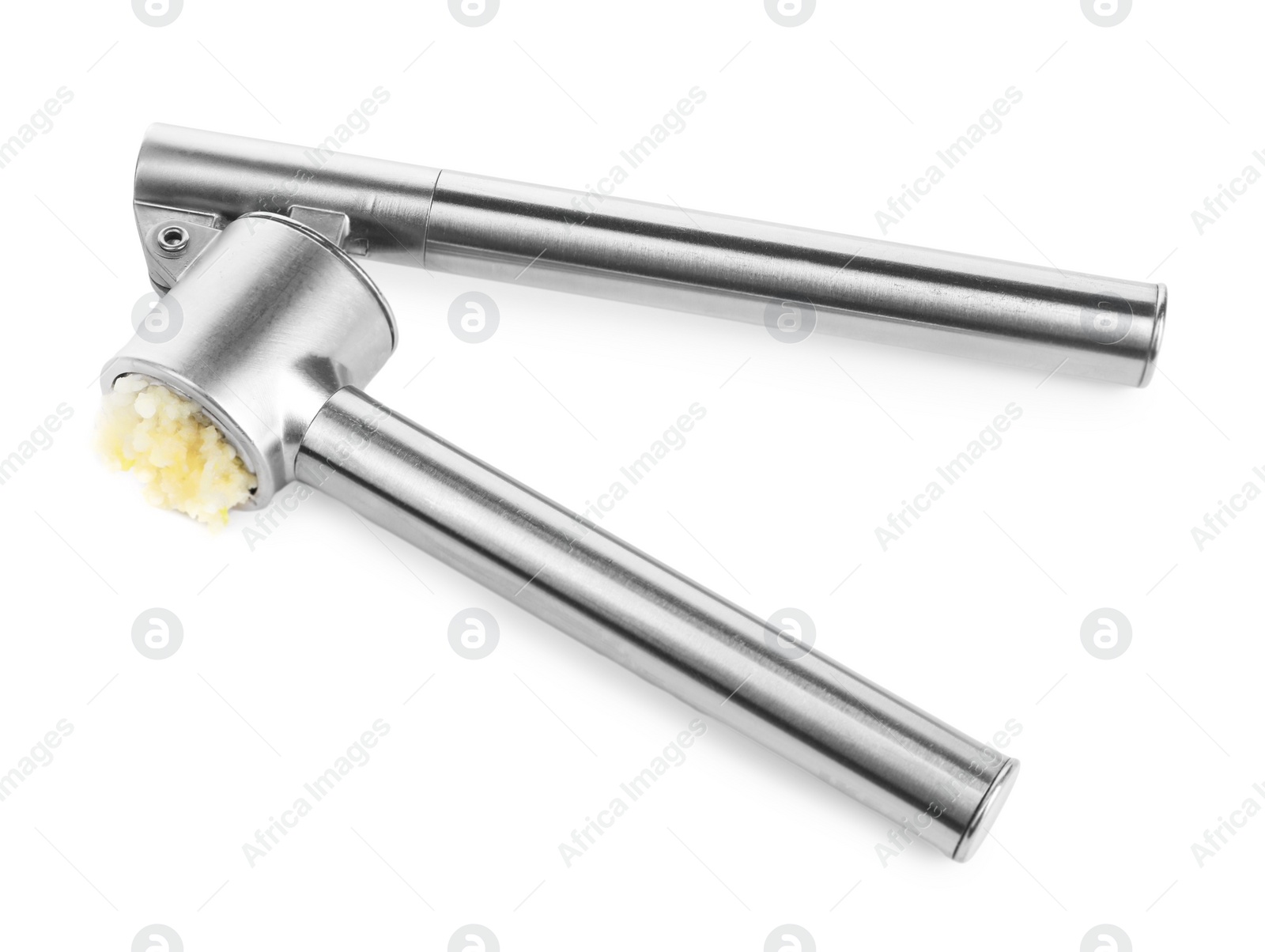 Photo of One metal press with crushed garlic isolated on white, above view