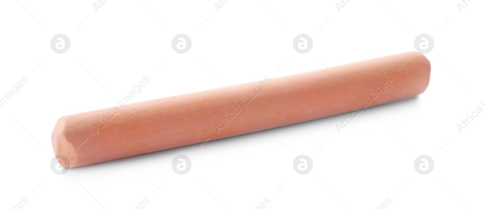 Photo of Piece of orange chalk isolated on white