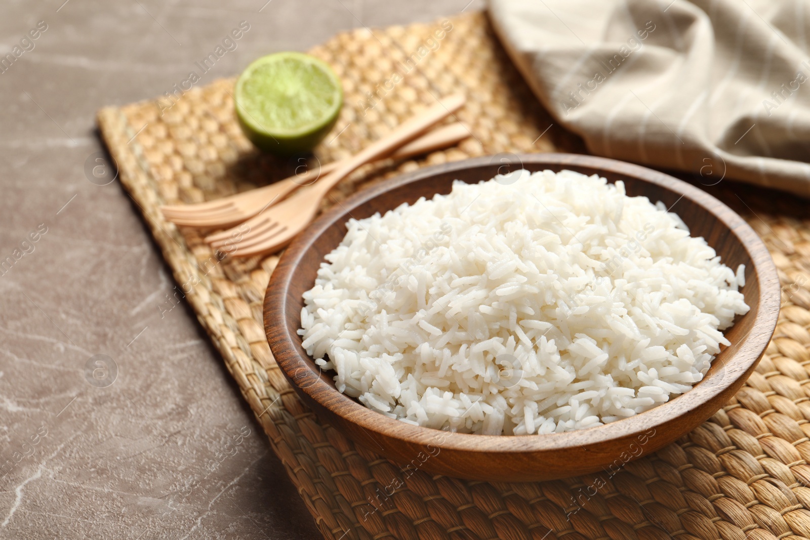 Photo of Plate of tasty cooked rice served on table. Space for text