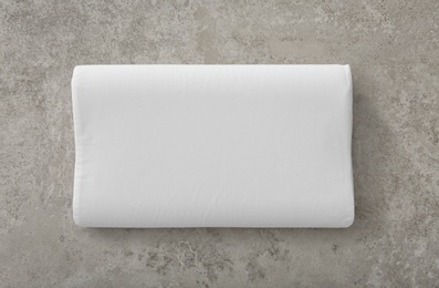 Photo of Soft bed pillow on gray background, top view