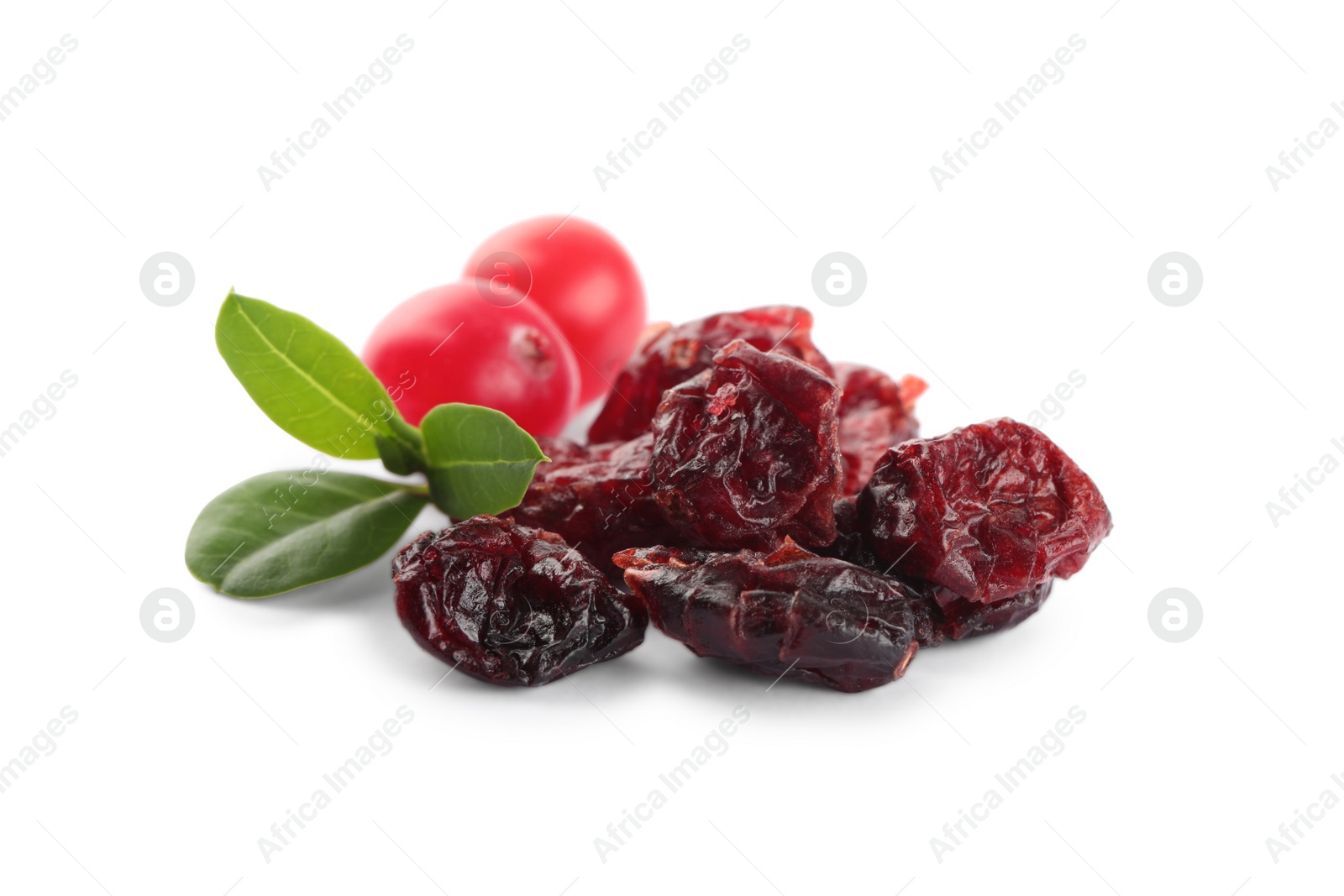 Photo of Dried and fresh cranberries with green leaves isolated on white