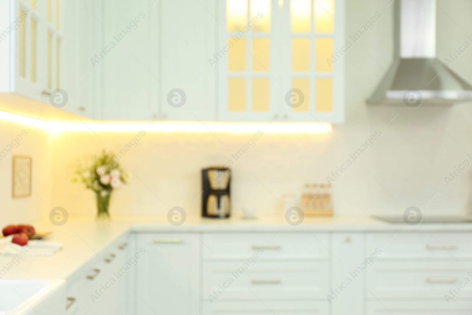 Photo of Blurred view of modern kitchen interior with stylish furniture