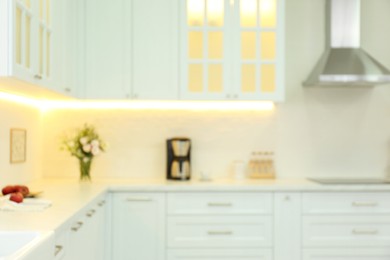 Blurred view of modern kitchen interior with stylish furniture