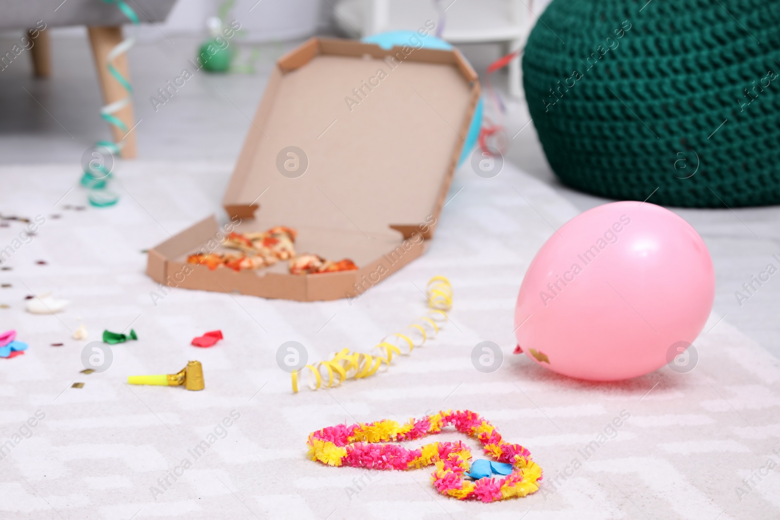 Photo of Messy apartment floor with garbage left after party