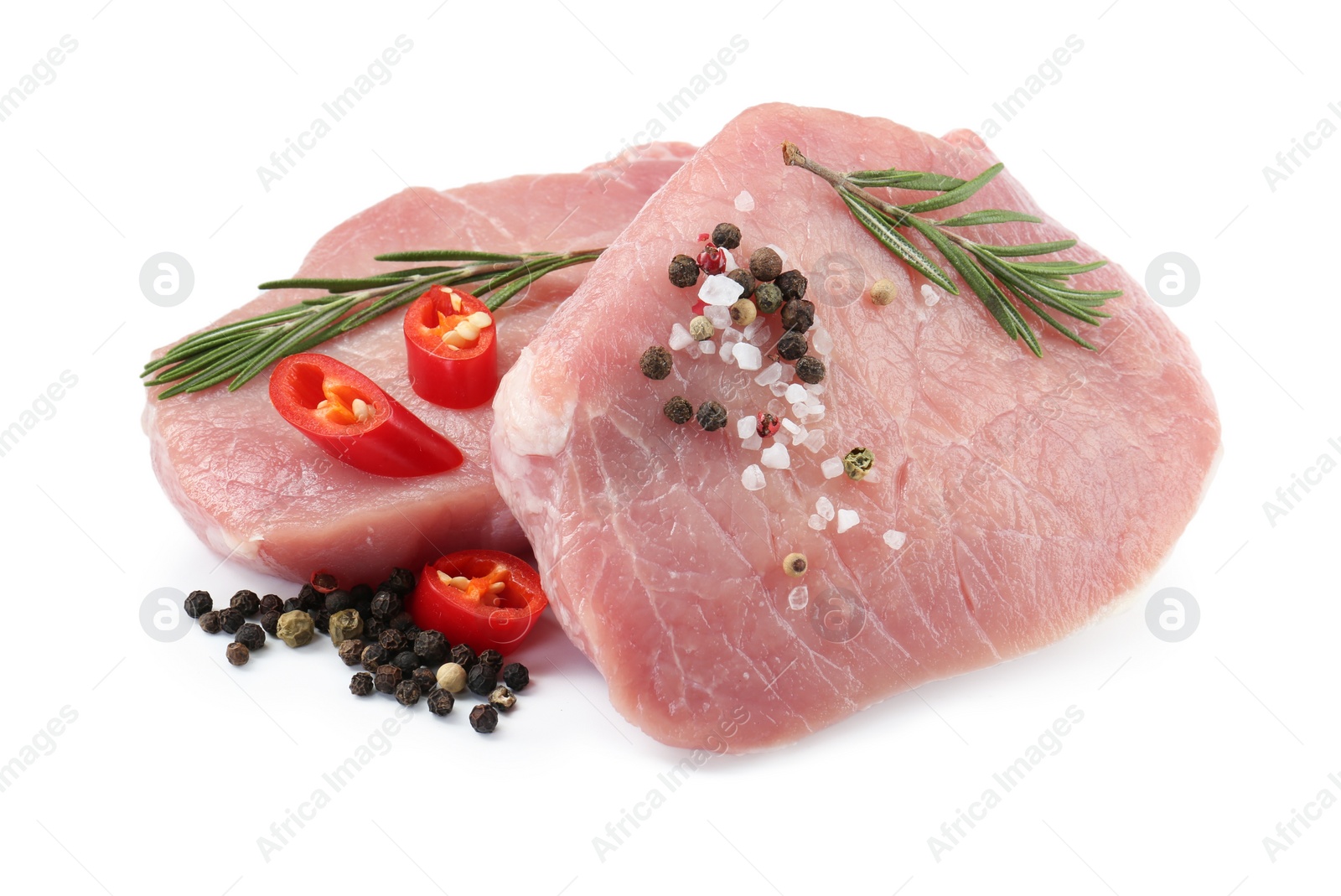 Photo of Pieces of raw pork meat and spices isolated on white