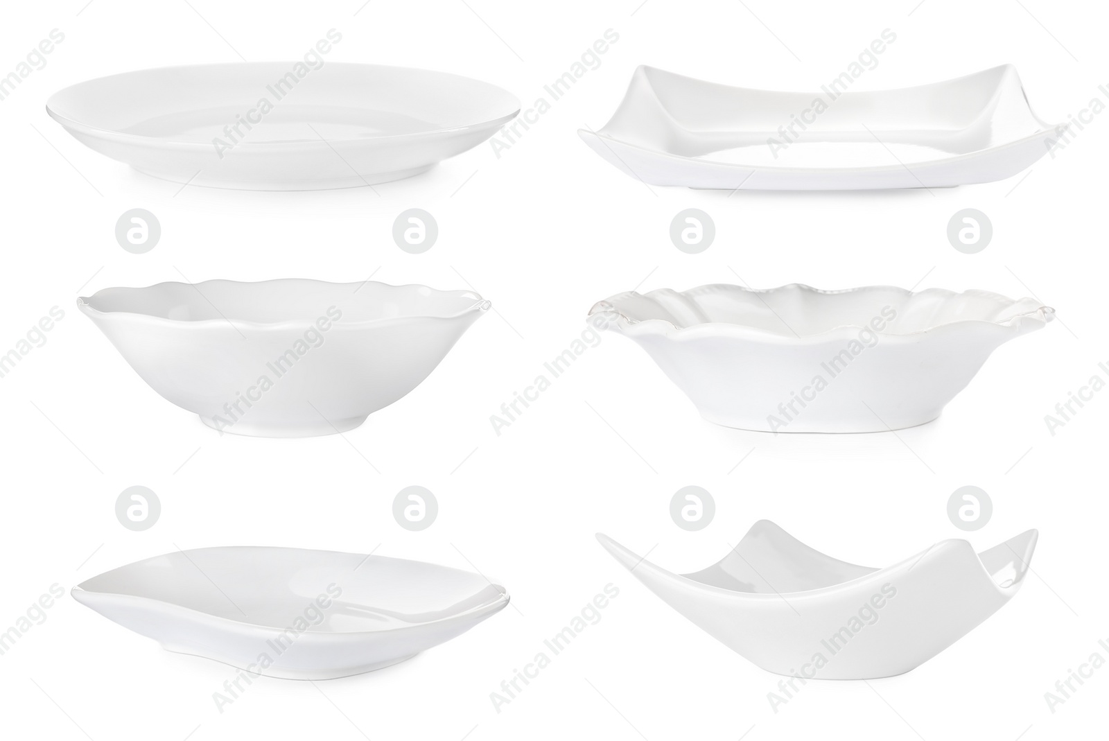 Image of Set with empty ceramic plates and bowls on white background