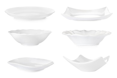 Image of Set with empty ceramic plates and bowls on white background