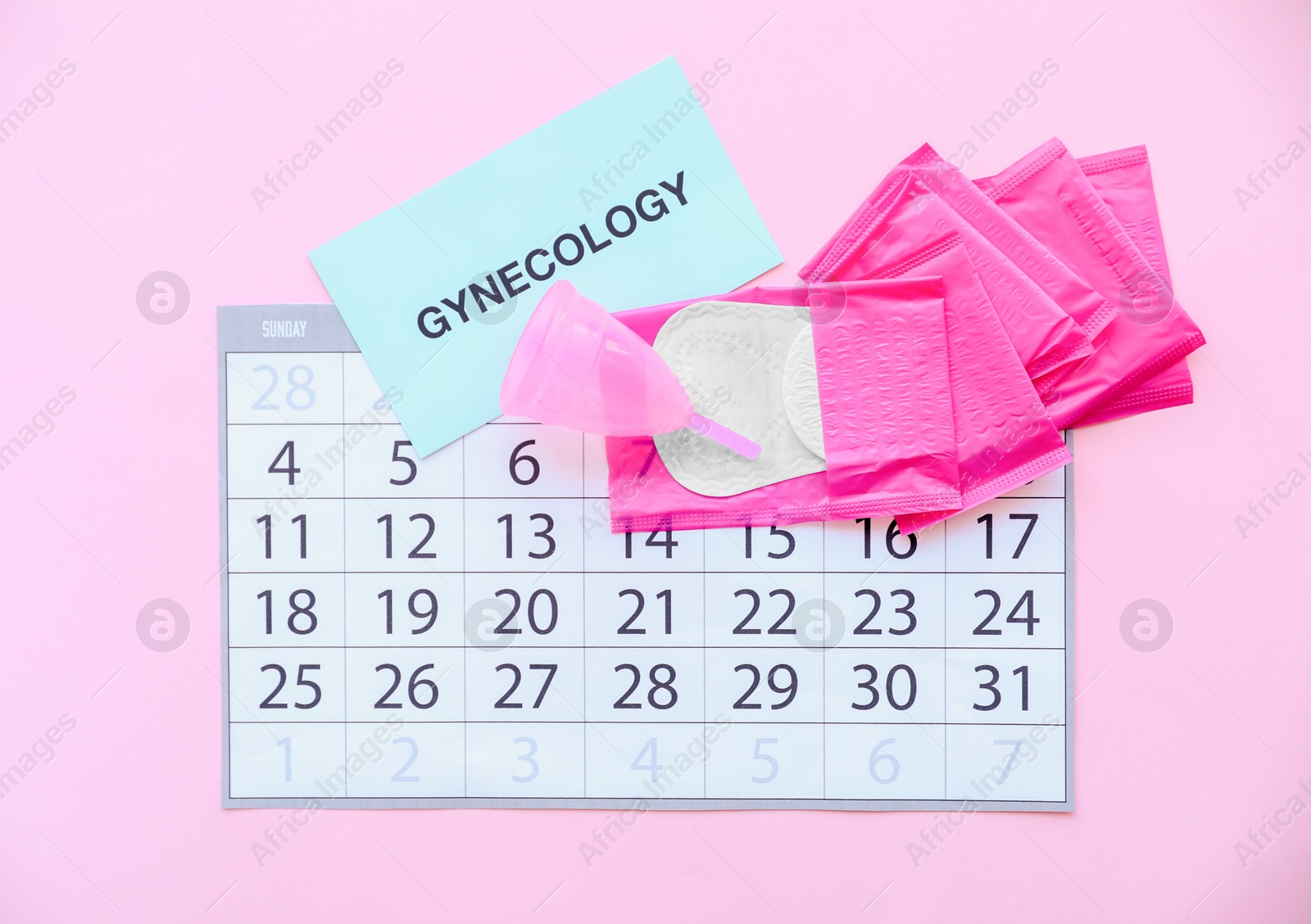 Photo of Flat lay composition with calendar and feminine hygiene items on color background. Gynecological care