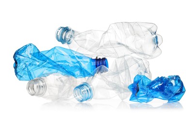 Photo of Crumpled disposable plastic bottles isolated on white