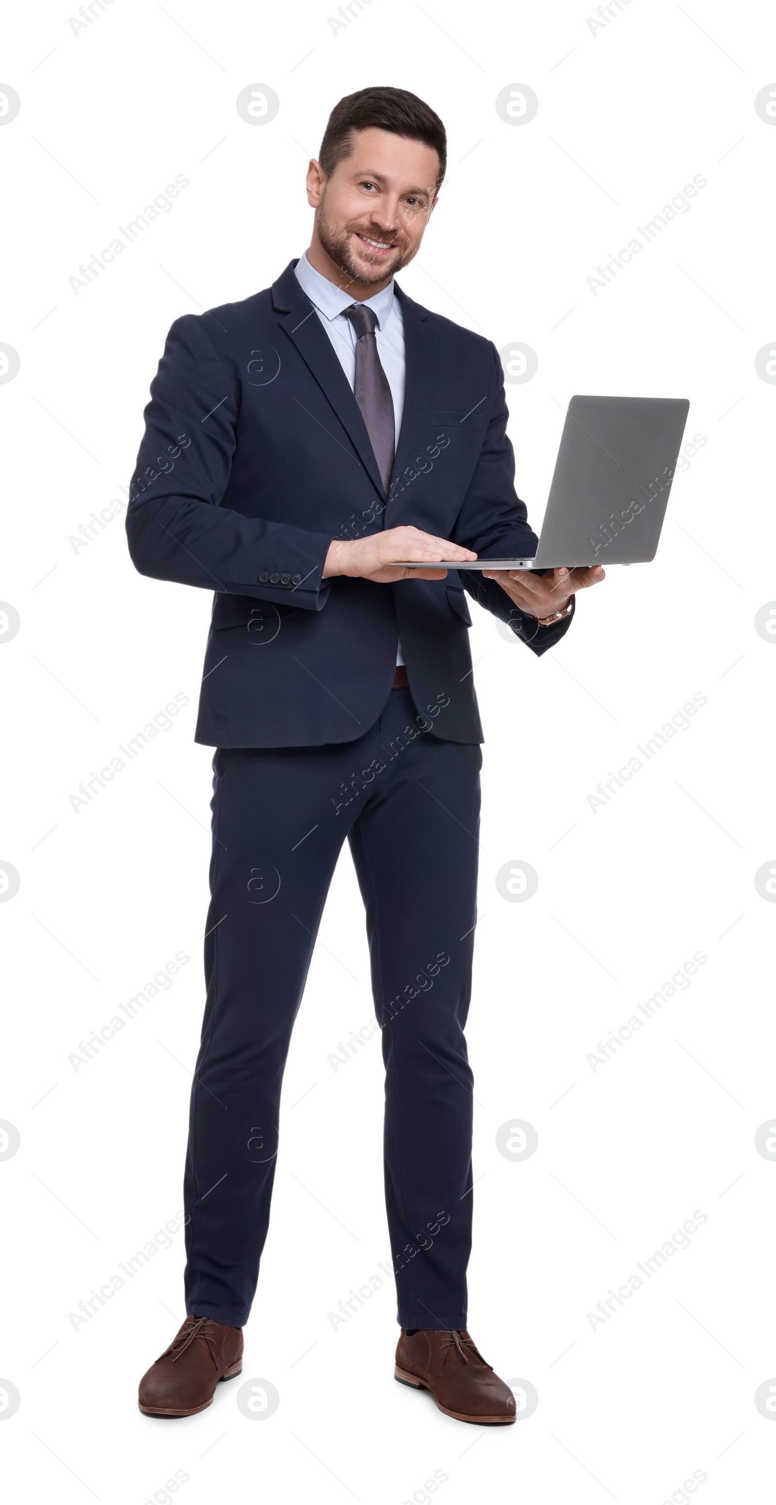 Photo of Handsome bearded businessman in suit with laptop on white background