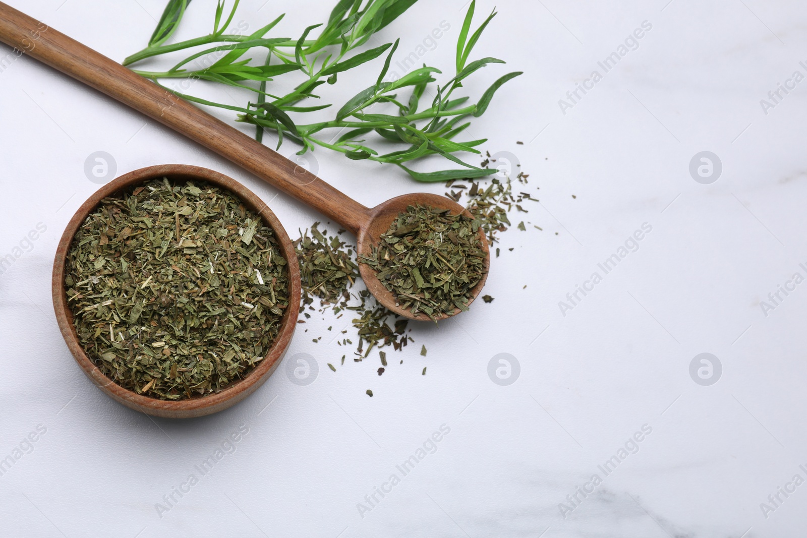 Photo of Dry and fresh tarragon on white table, flat lay. Space for text