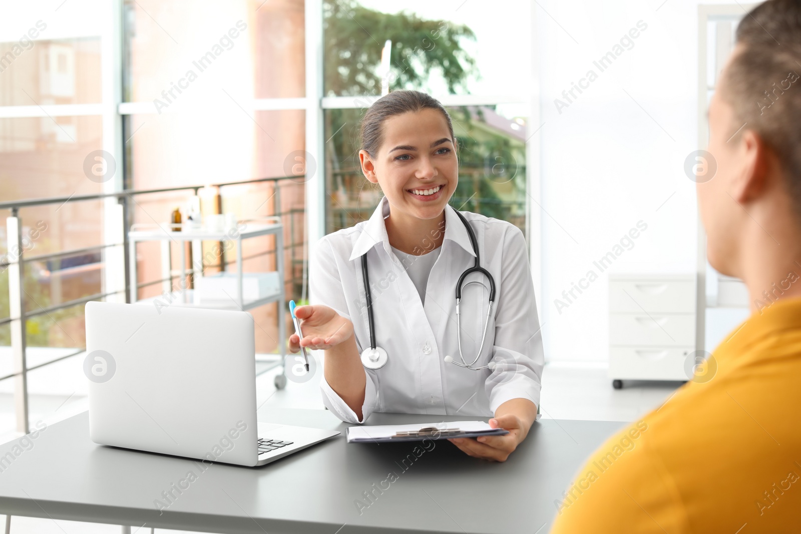 Photo of Doctor talking to her patient in hospital