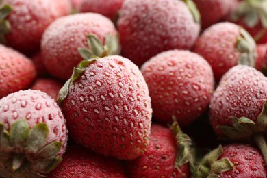 Tasty frozen strawberries as background, closeup view