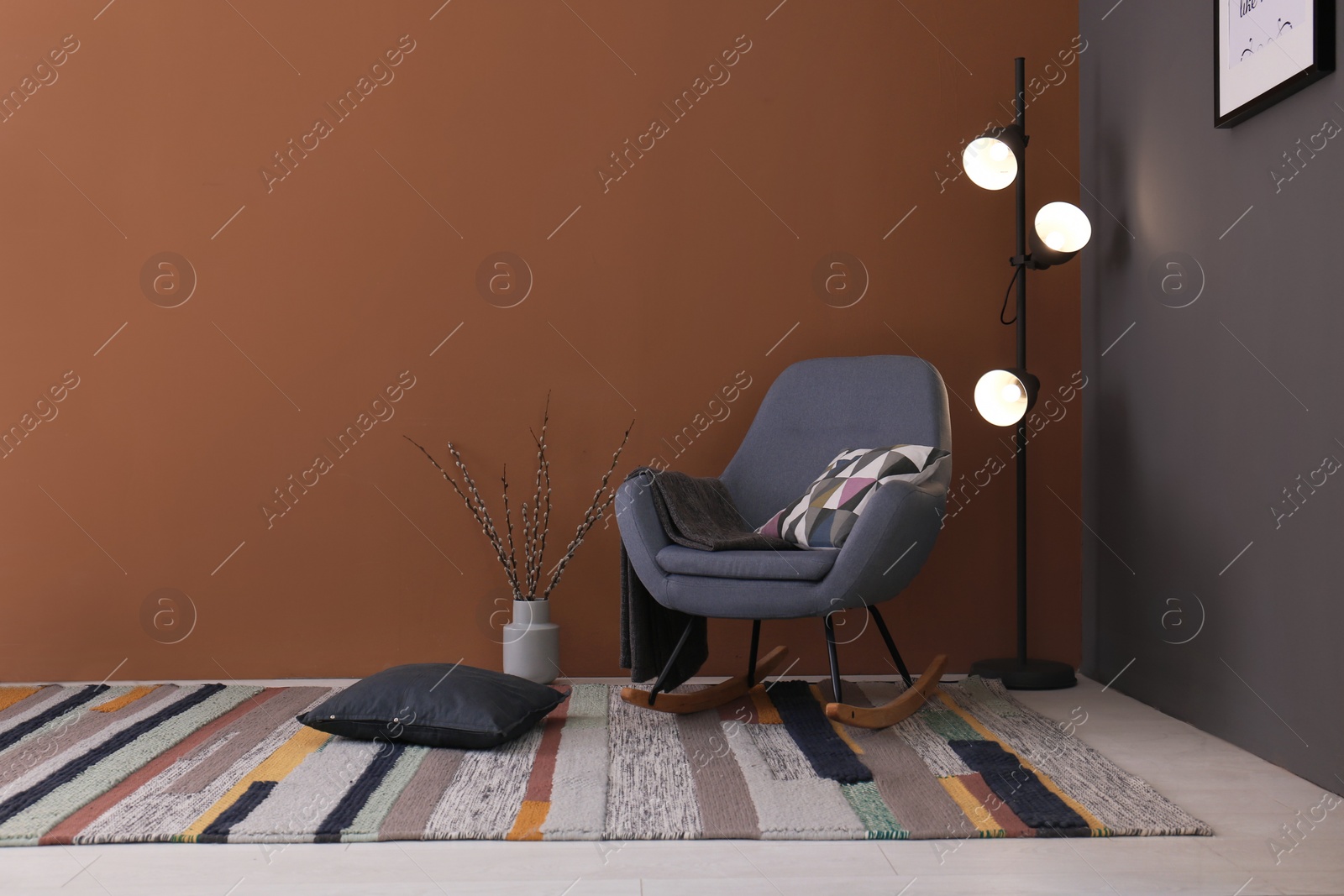 Photo of Modern living room interior with comfortable rocking chair and beautiful carpet