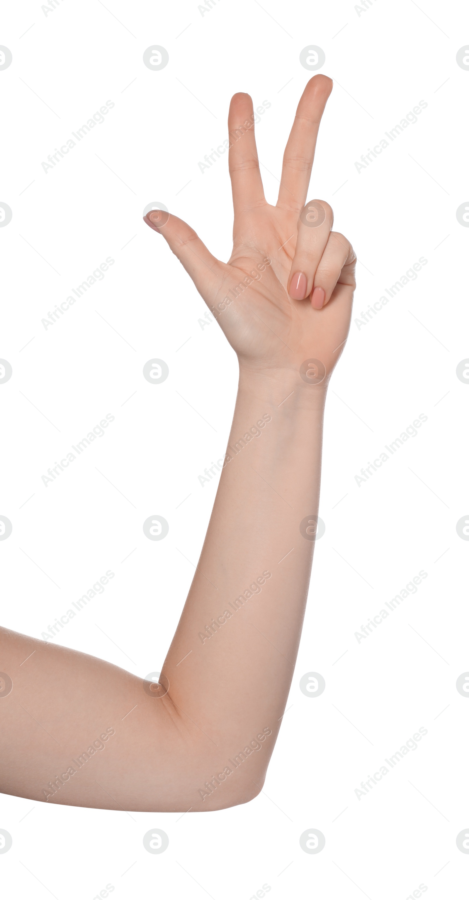 Photo of Playing rock, paper and scissors. Woman making scissors with her fingers on white background, closeup