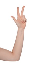 Photo of Playing rock, paper and scissors. Woman making scissors with her fingers on white background, closeup