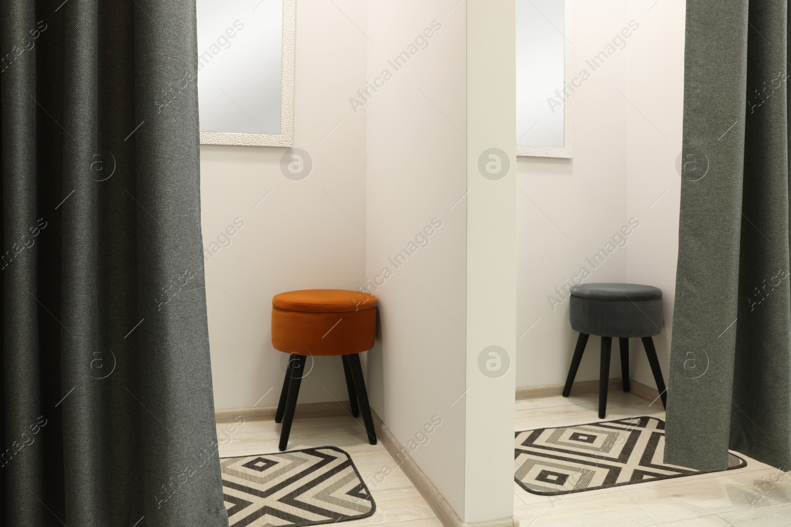 Photo of Empty dressing rooms in store. Stylish interior