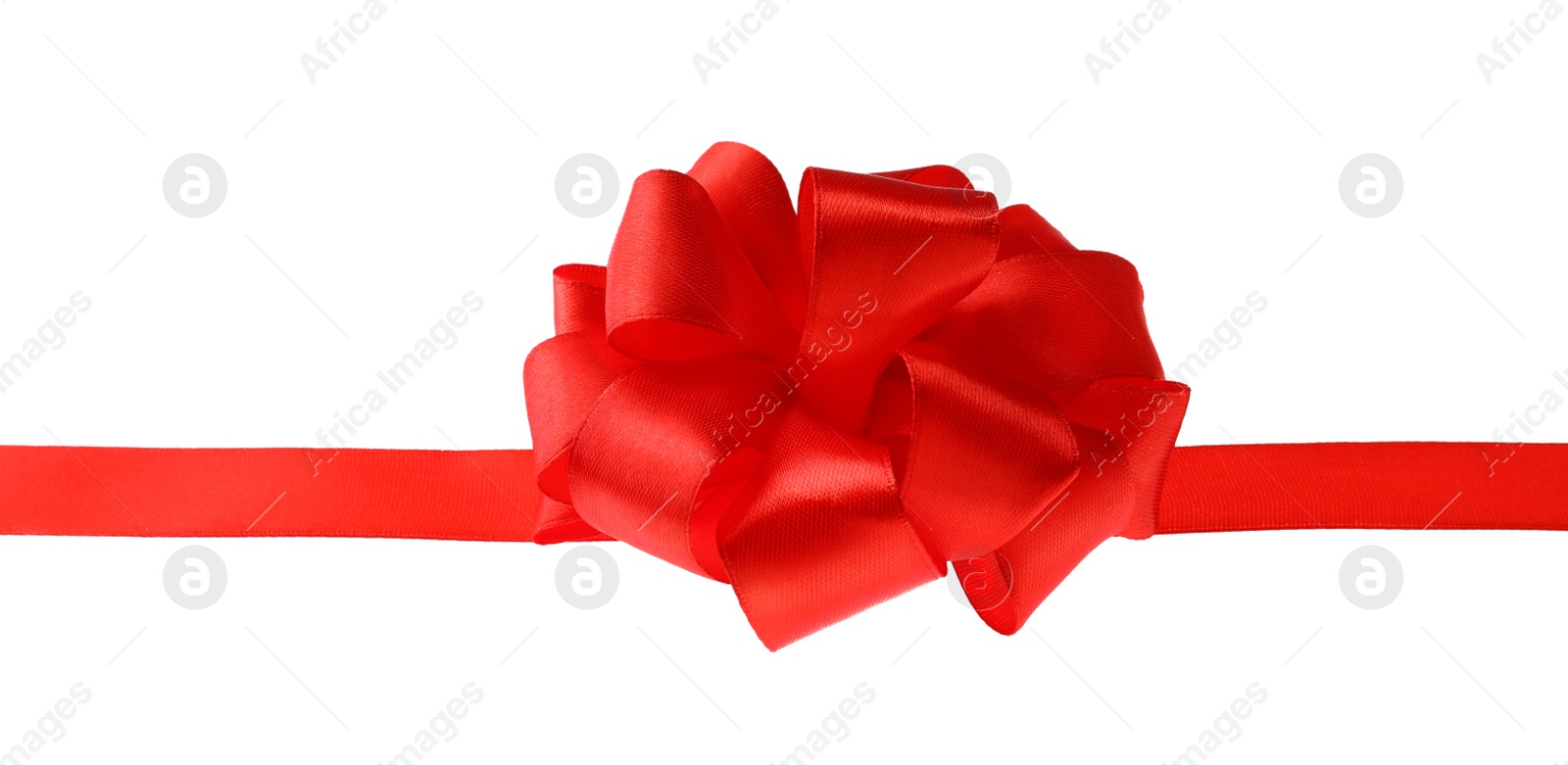 Photo of Red ribbon with bow on white background. Festive decoration