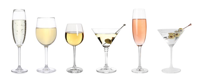 Set with different wines and cocktails in glasses on white background