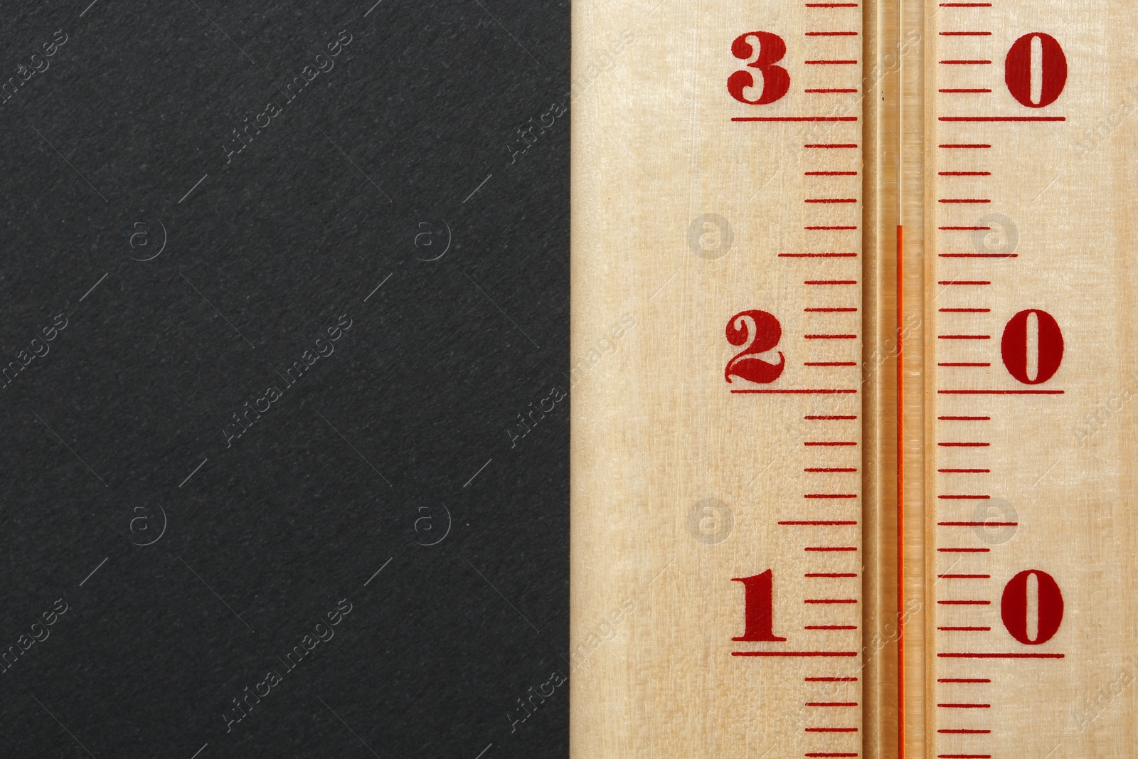 Photo of Weather thermometer on dark background, closeup view with space for text