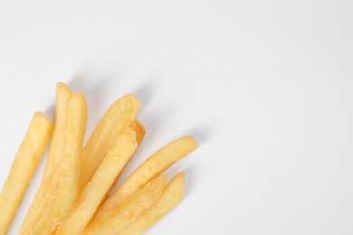Delicious french fries on white background, flat lay. Space for text