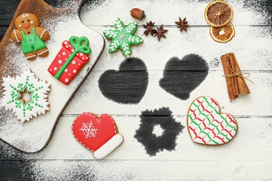 Photo of Flat lay composition with delicious homemade Christmas cookies and flour on table