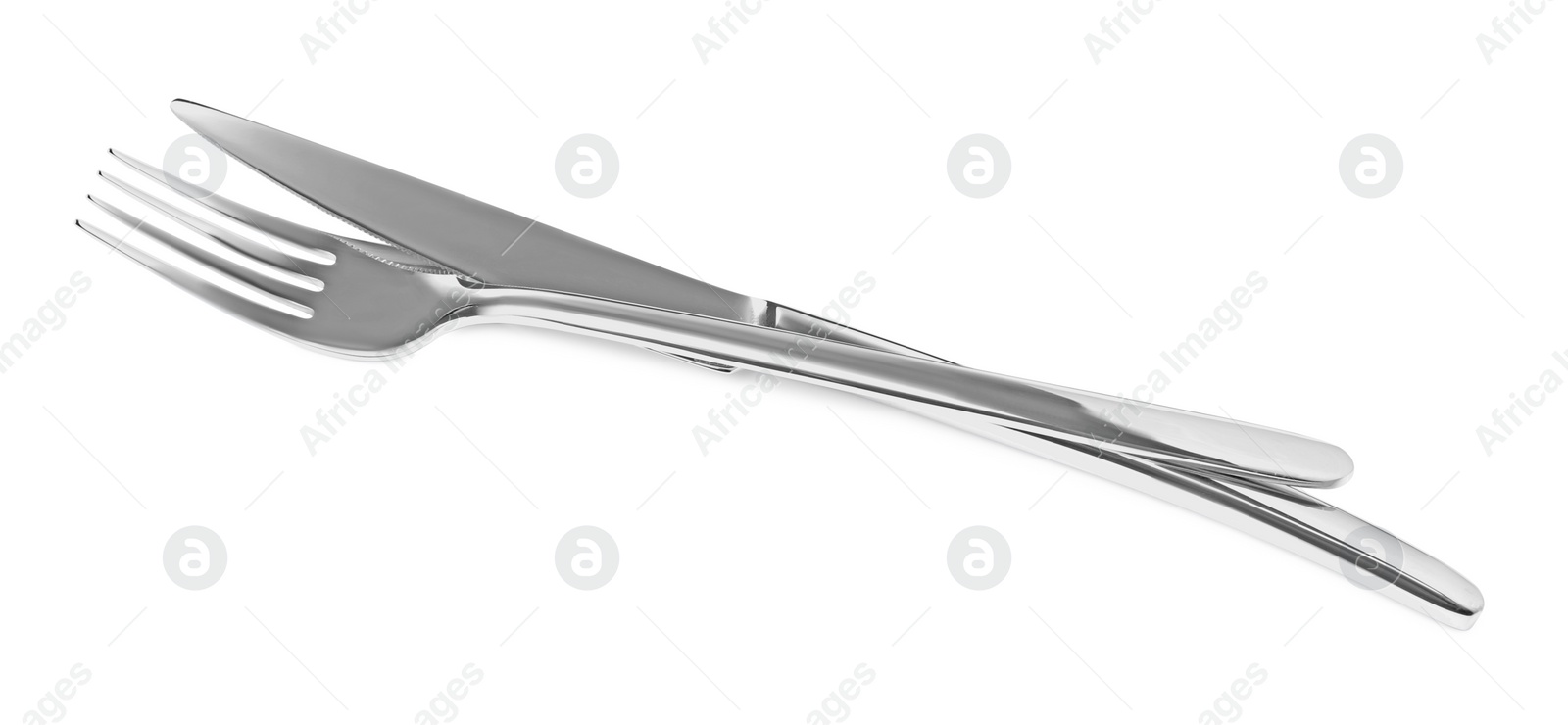 Photo of Fork and knife isolated on white. Stylish shiny cutlery set