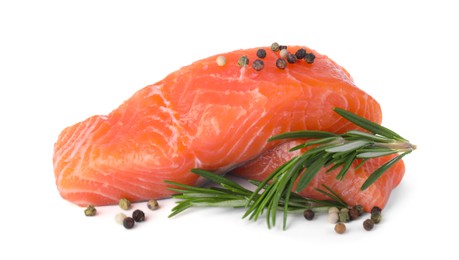 Photo of Pieces of fresh raw salmon and spices on white background