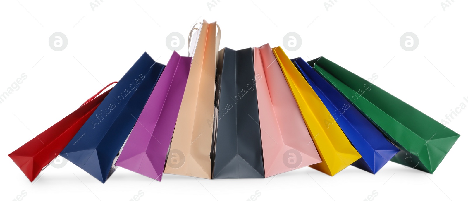 Photo of Colorful paper shopping bags isolated on white