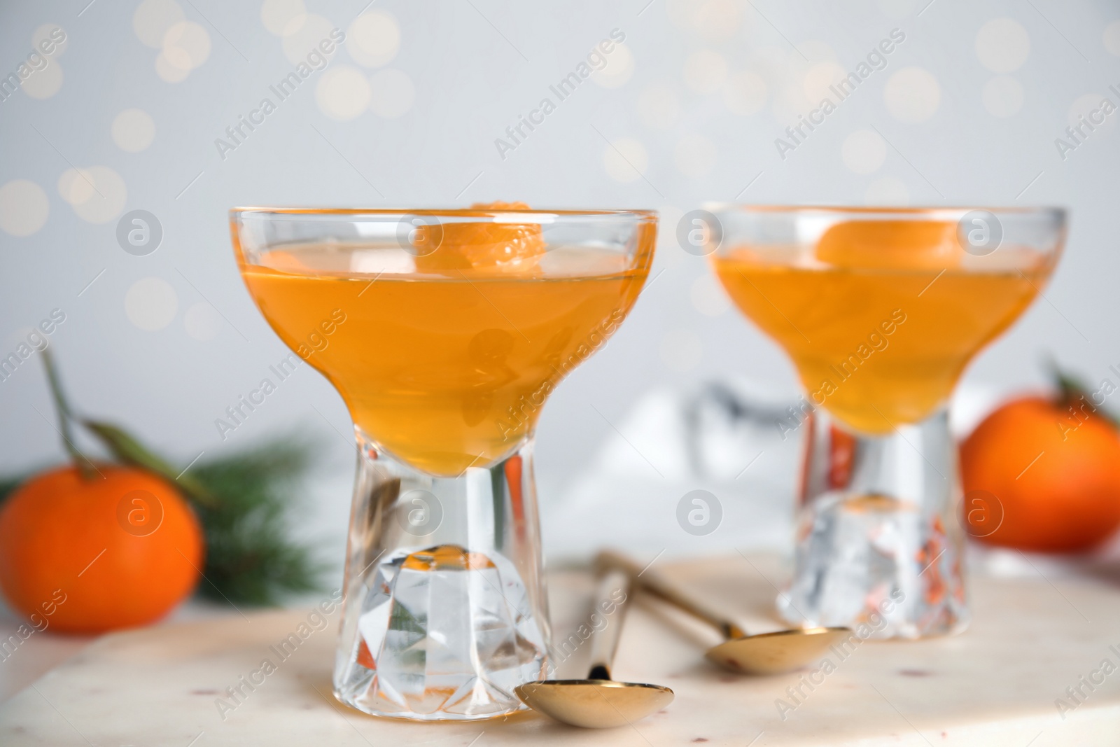 Photo of Delicious tangerine jelly on white marble board