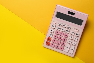 Modern calculator on color background, top view. Space for text