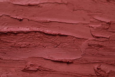 Texture of bright lipstick as background, closeup